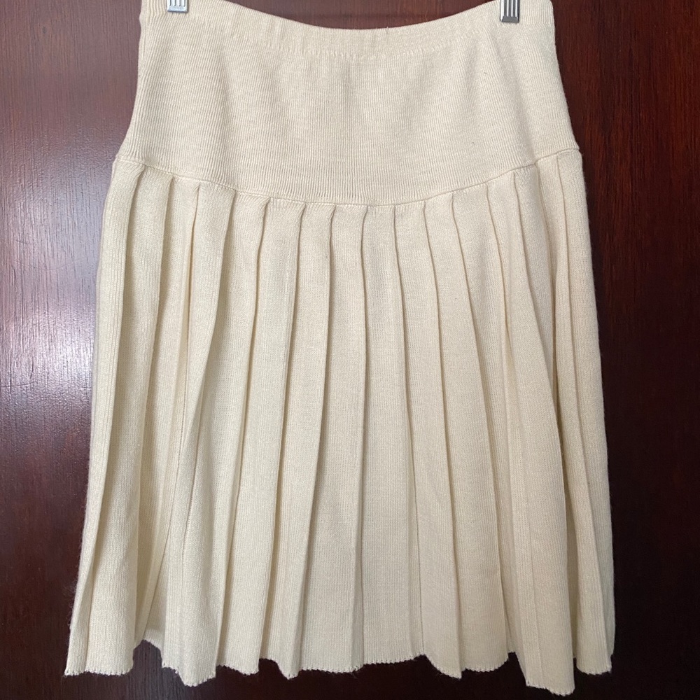 Cream / off-white colored pleated skirt by Jessica Scott. Size med/6
